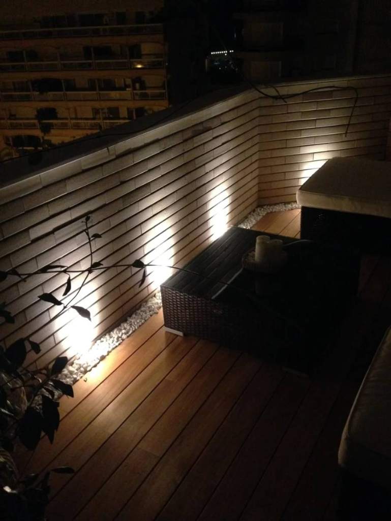 Lighting integrated into the planter border at night