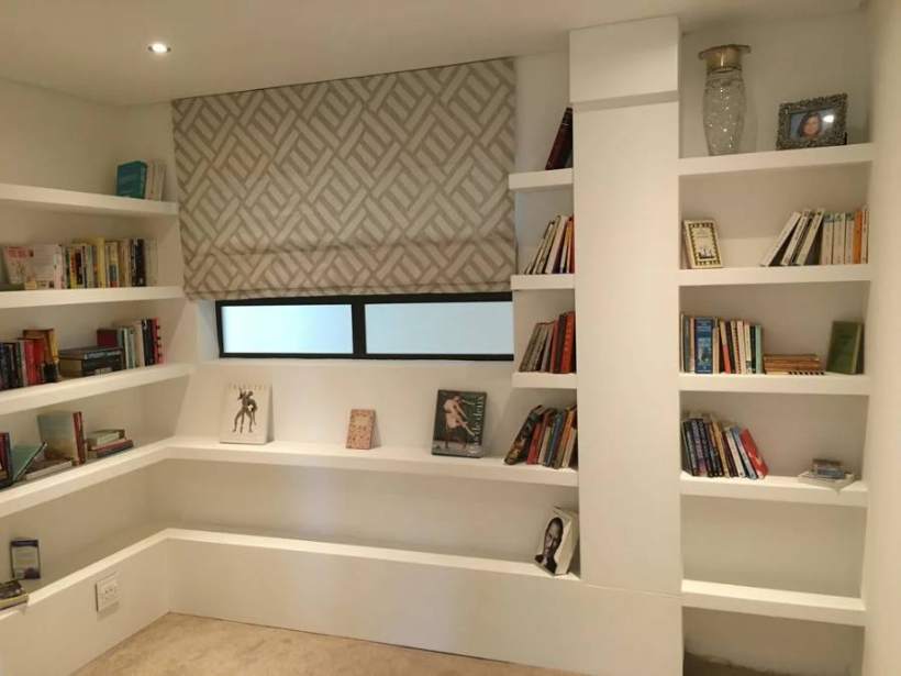 Built-in bookshelves styled in a Cape Town flat